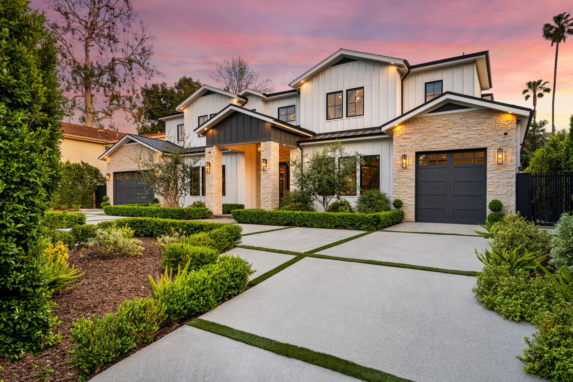 House in a charming neighborhood with stunning sidewalk landscaping.