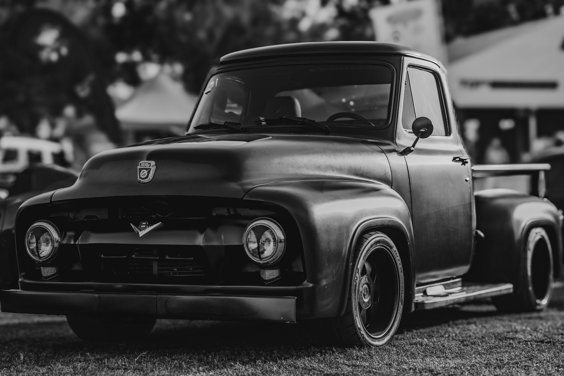 Black and white High perspective front corner view of a 1955 Ford F-100 Pickup Truck at a local car show. Doha, Qatar Aug 20, 2024